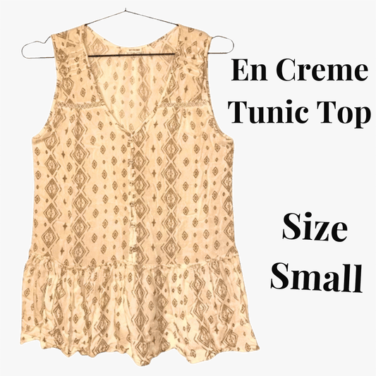 Beige patterned tunic top on a hanger with text indicating size small.