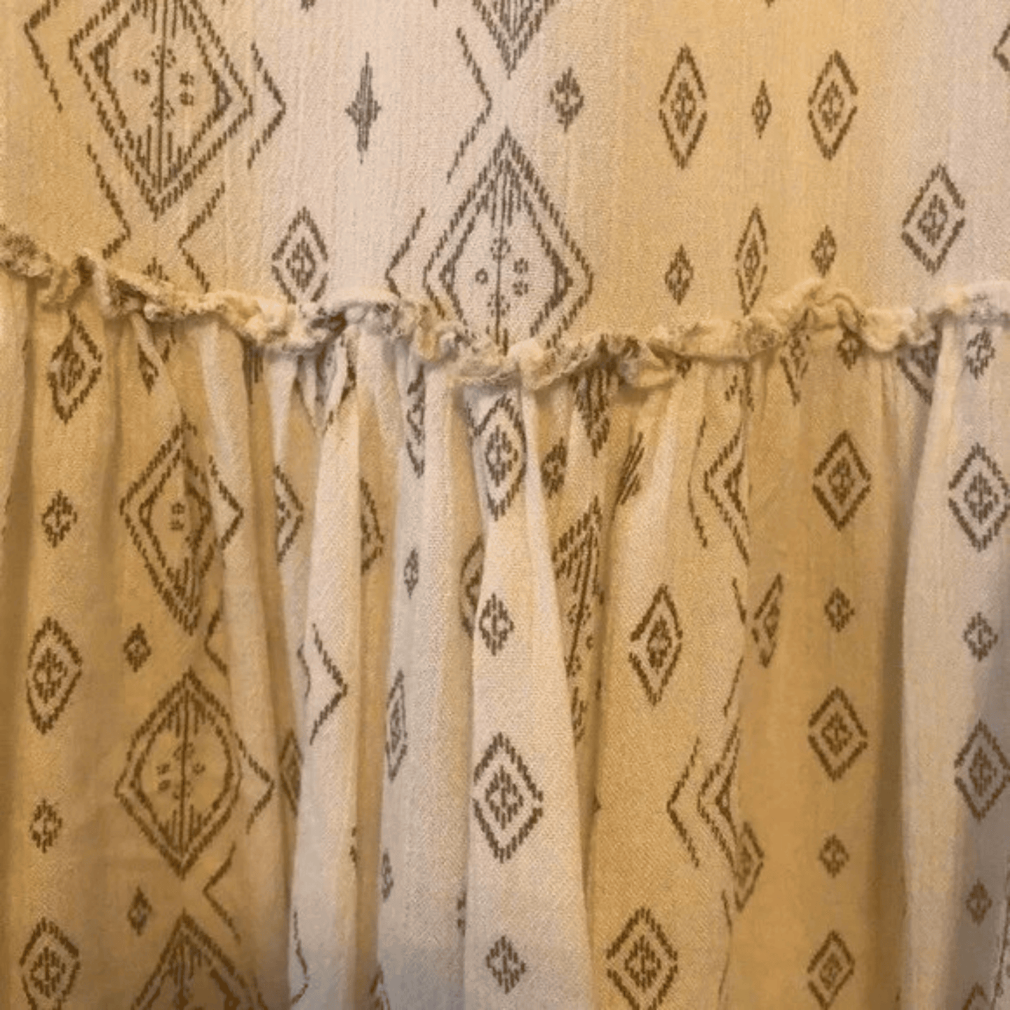 Beige curtains with diamond pattern on a beige background