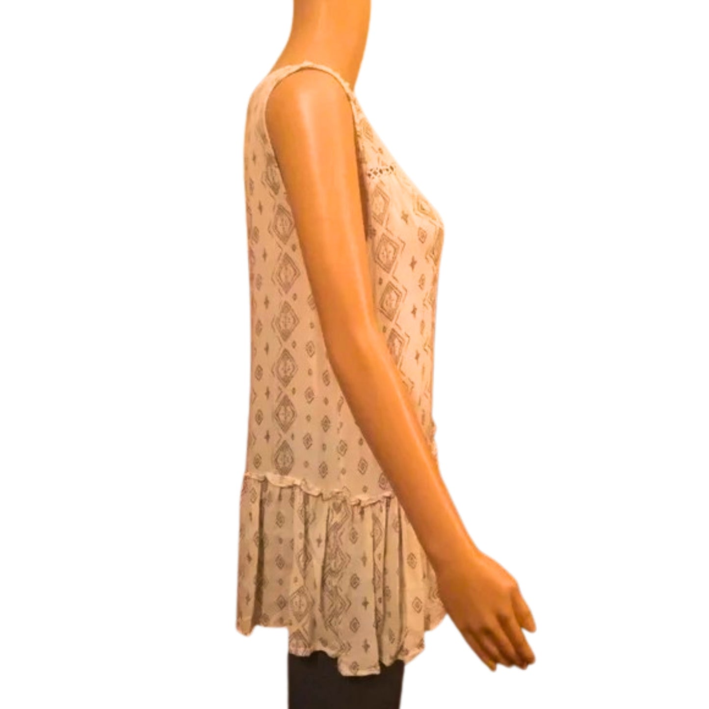 Beige lace top on a mannequin against a white background