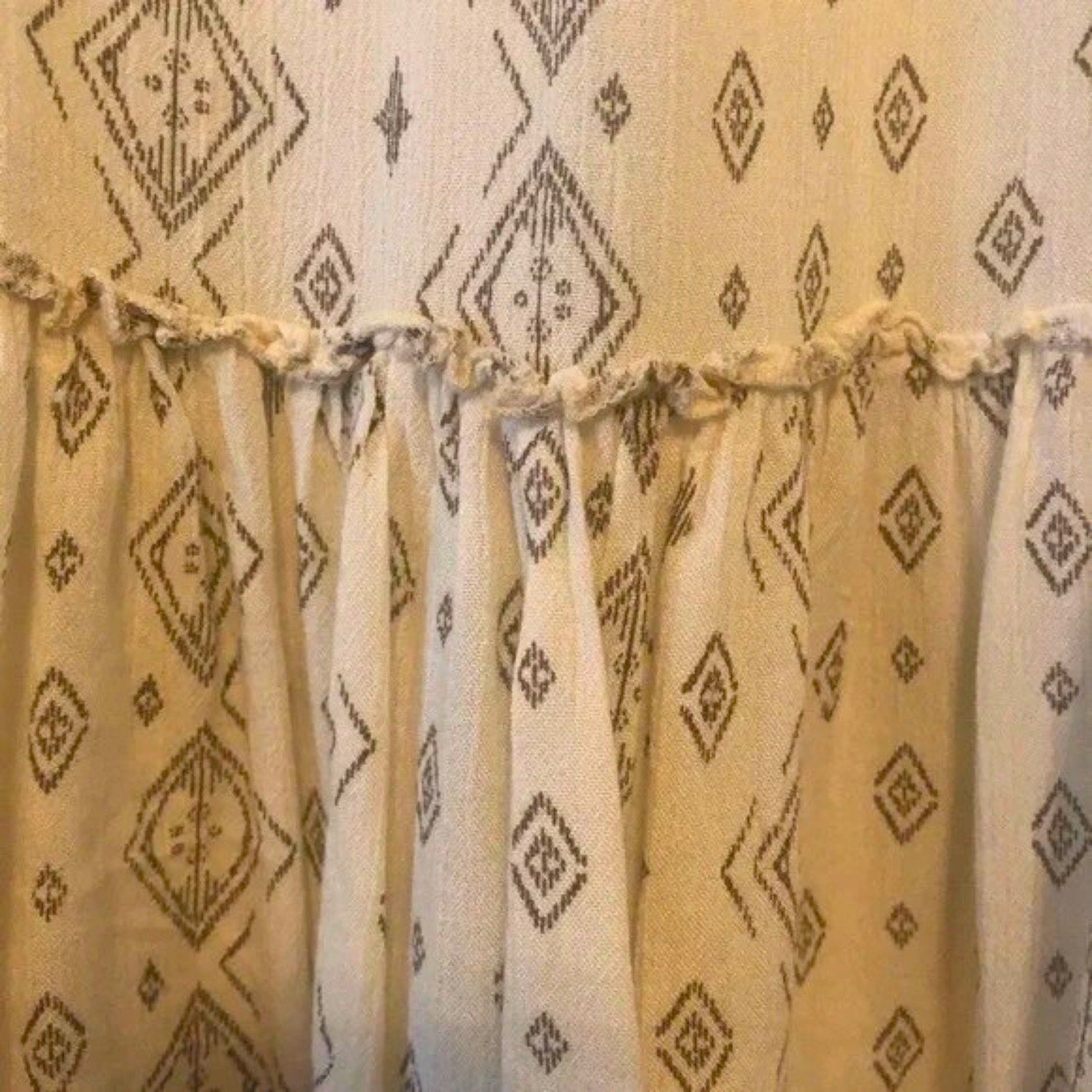 Curtains with geometric pattern on a neutral background