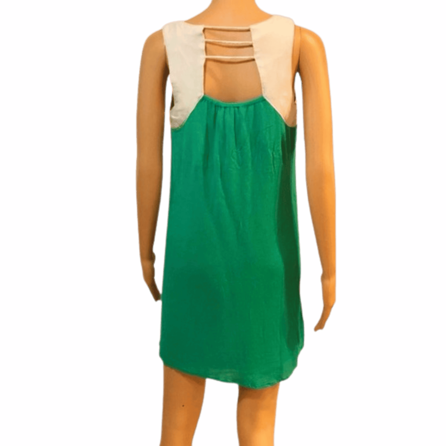 Green dress with beige top on a mannequin against a pink background