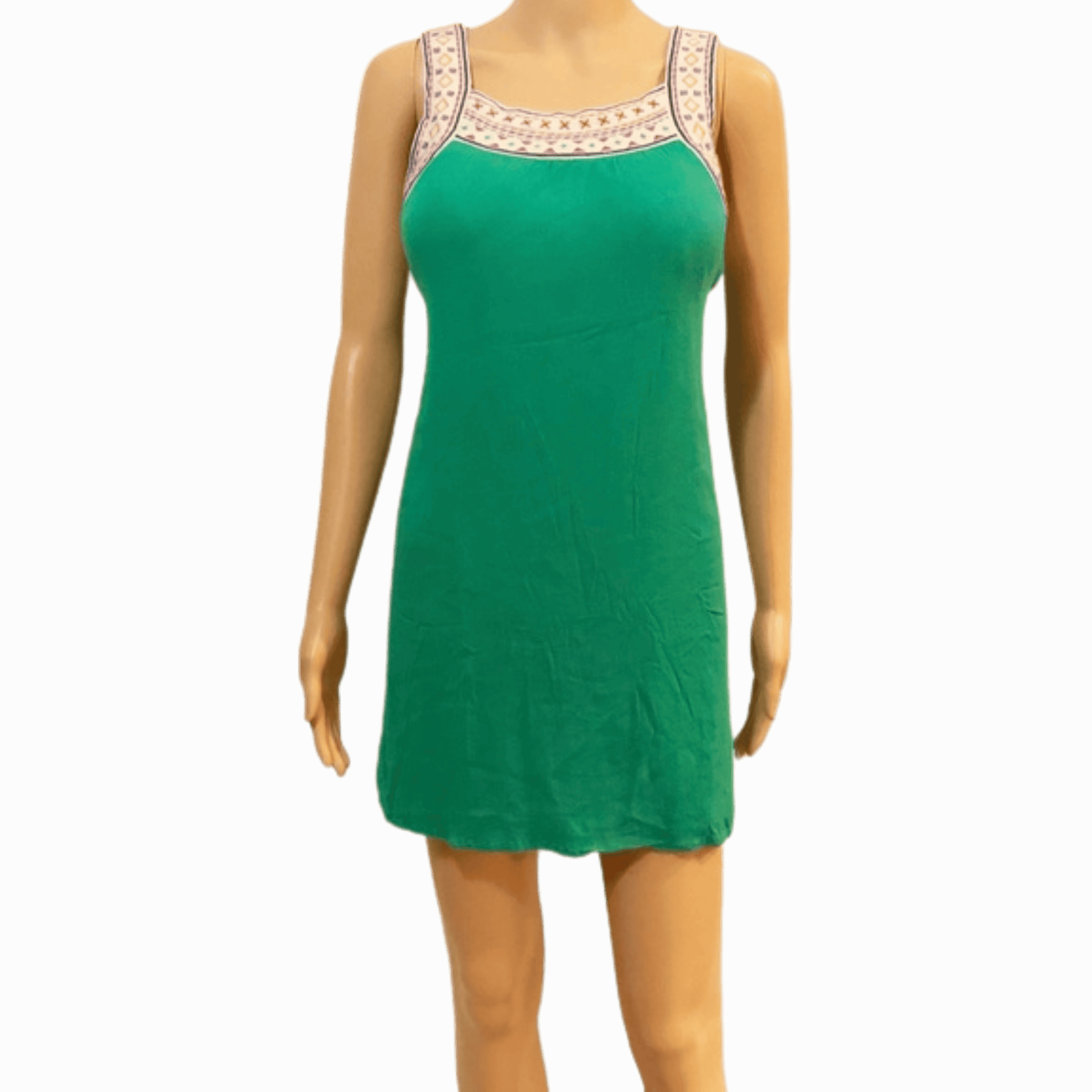 Green dress on a mannequin against a gray background