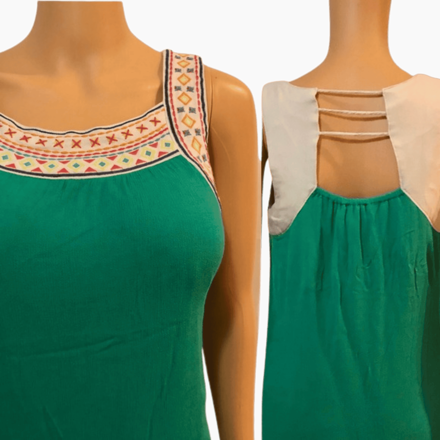 Green dress with embroidered neckline on a mannequin against a dark background