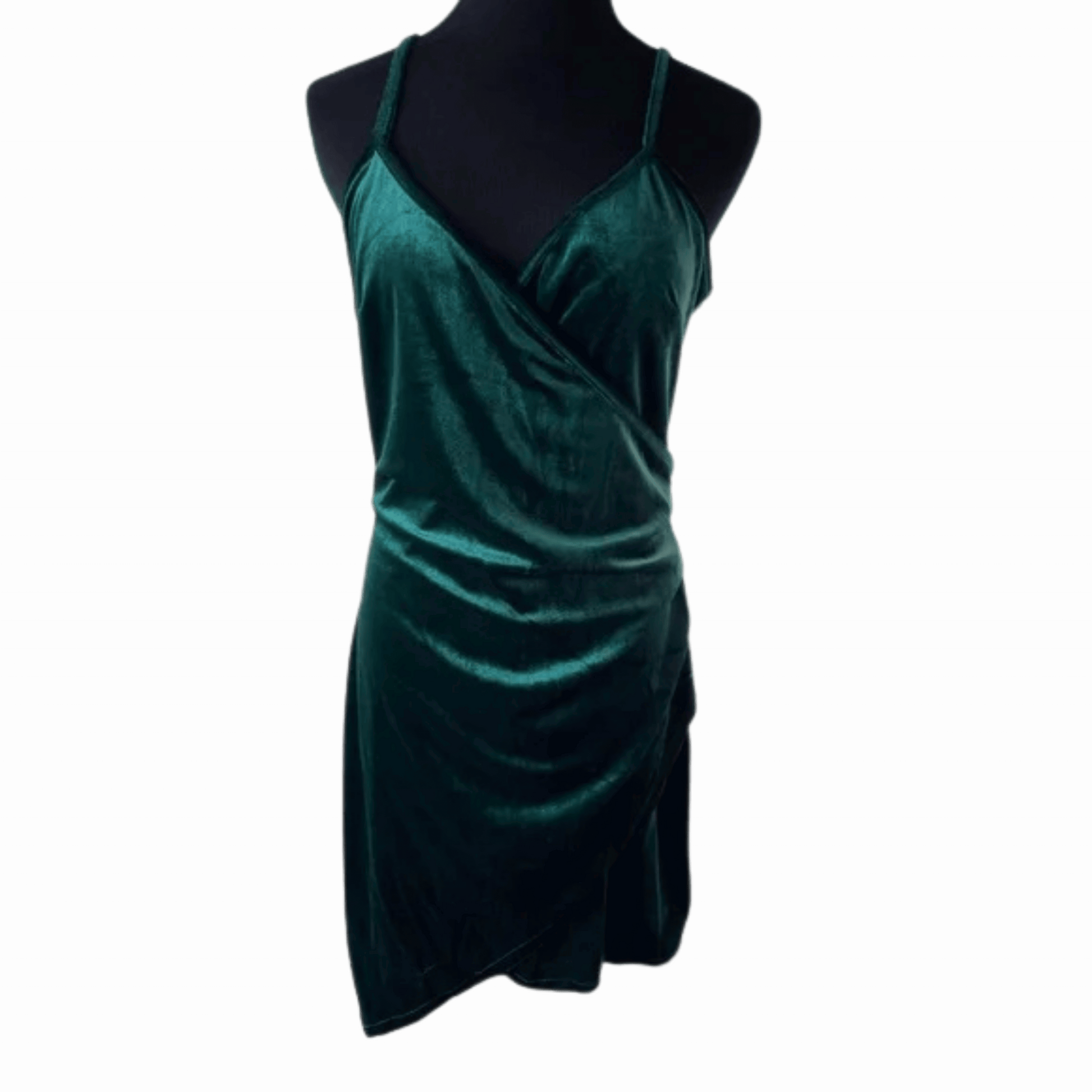 Green velvet dress on a mannequin against a teal background