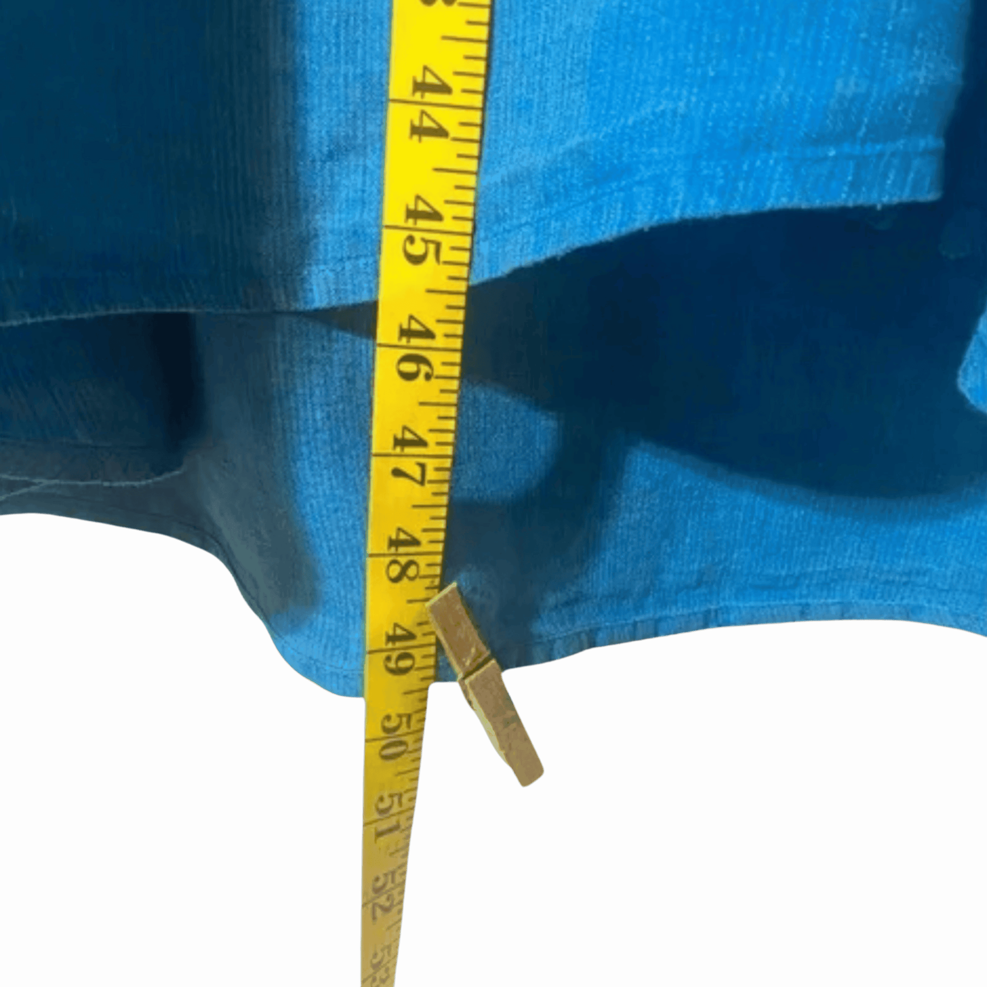 Yellow measuring tape on a blue fabric background