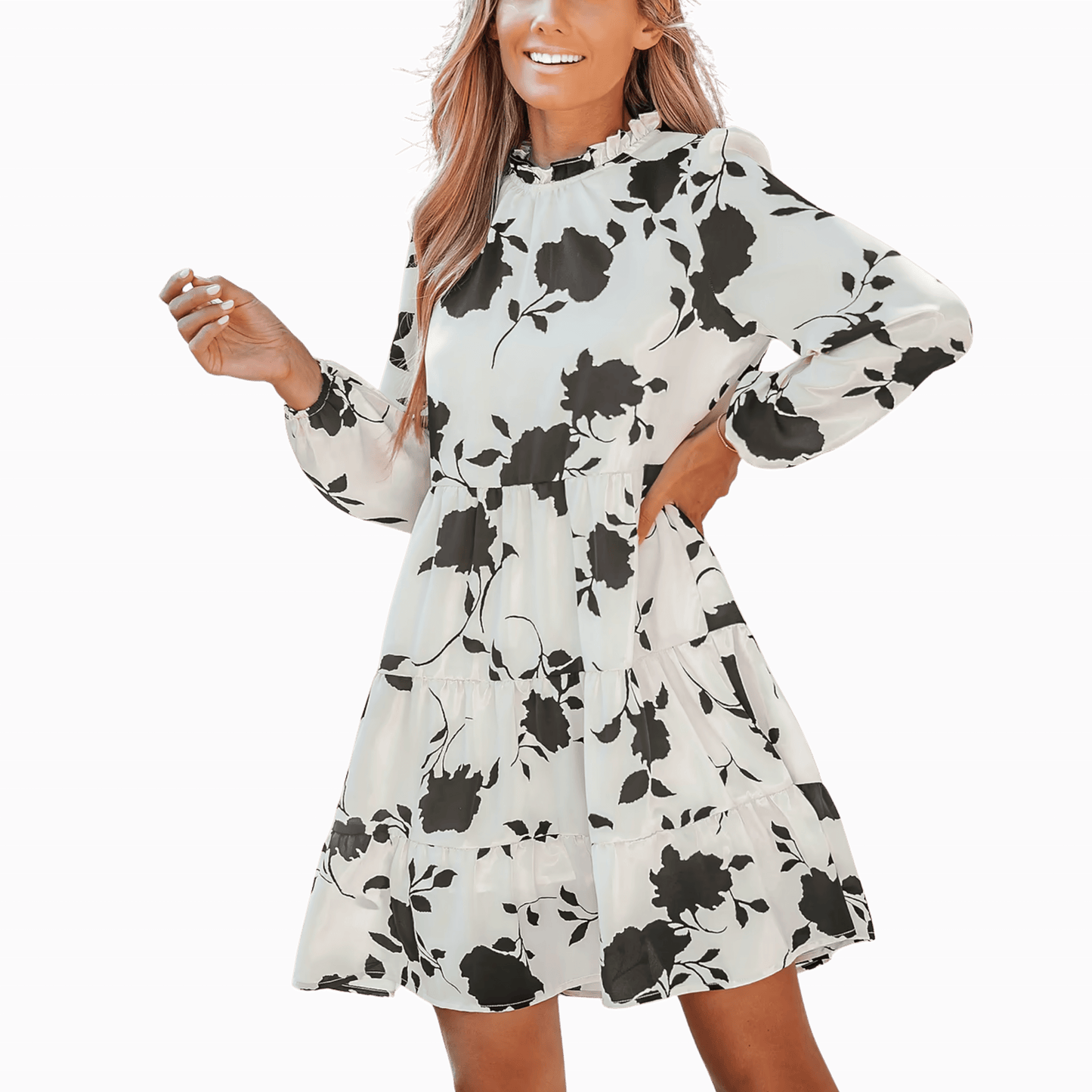 Woman wearing a white dress with black floral pattern on a purple background