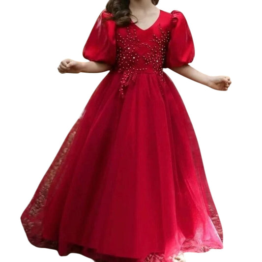 Red evening gown with beaded top and lace details on a white background