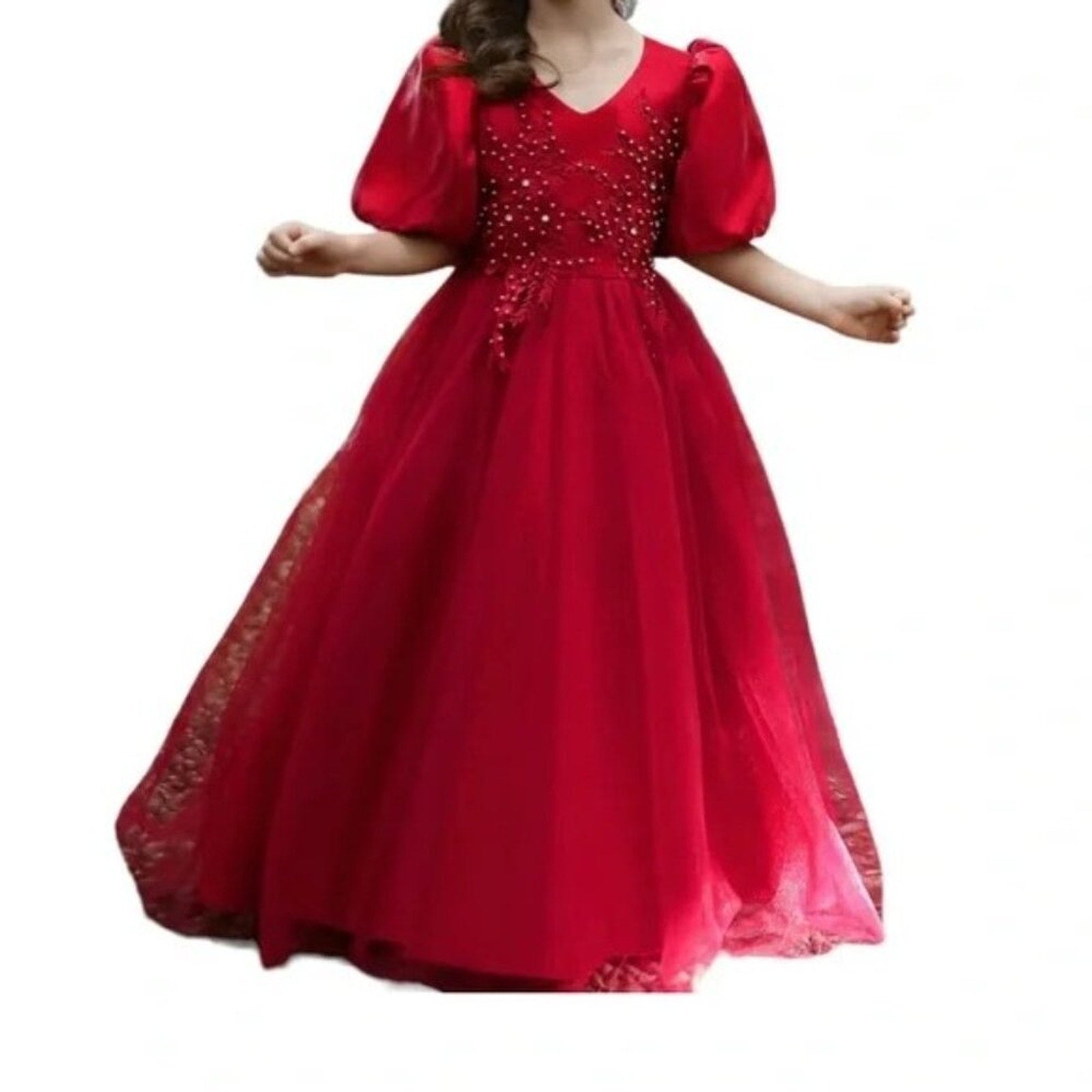 Red evening gown with beaded details on a white background