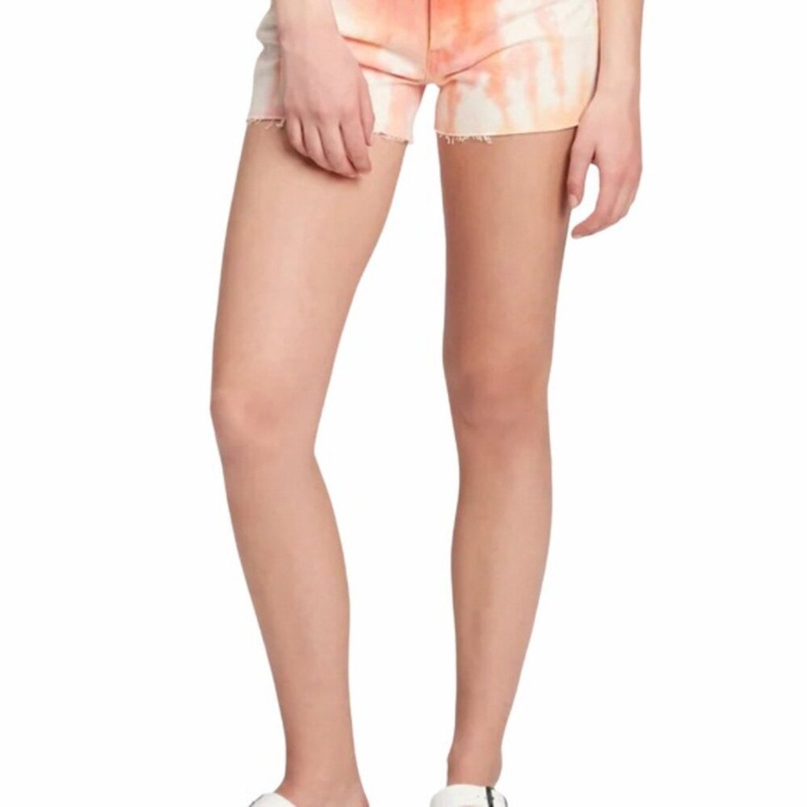 Tie-dye shorts worn by a person on a white background