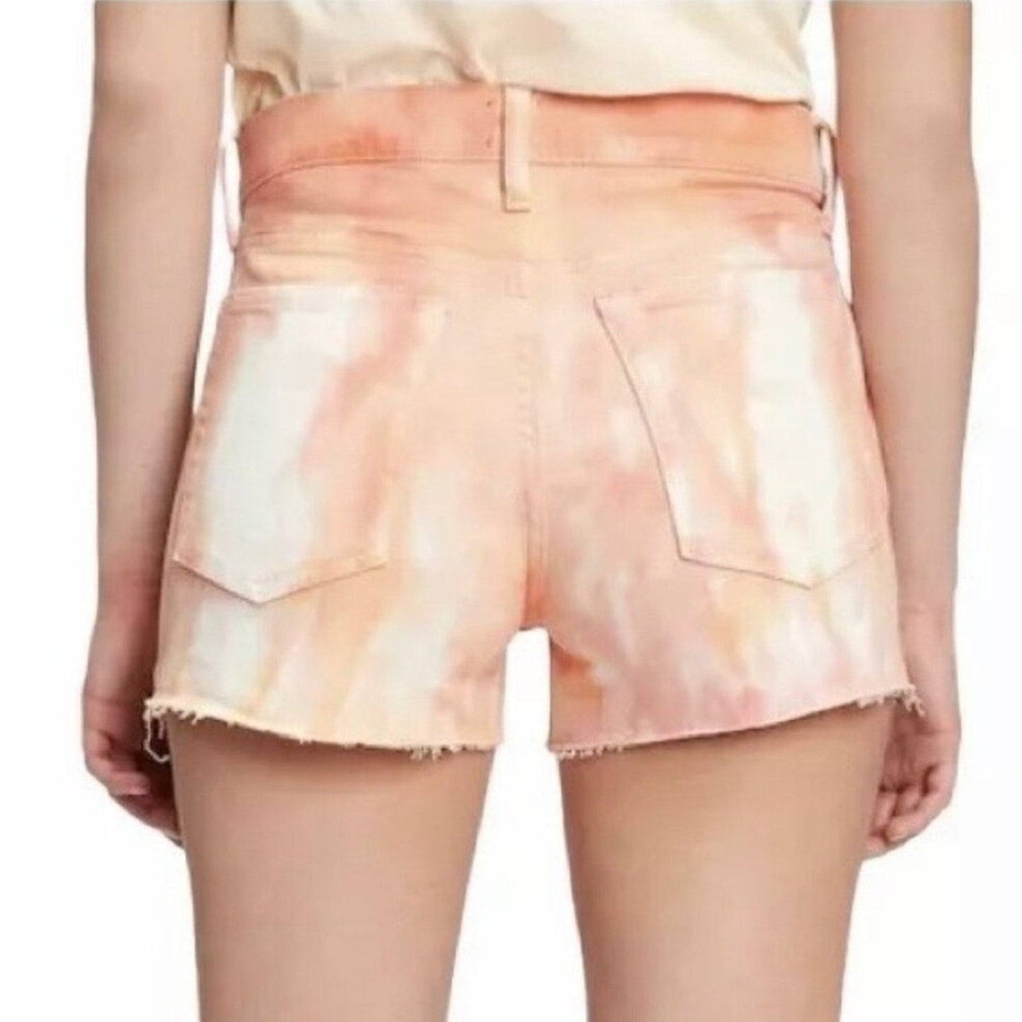 Tie-dye shorts worn by a person on a white background