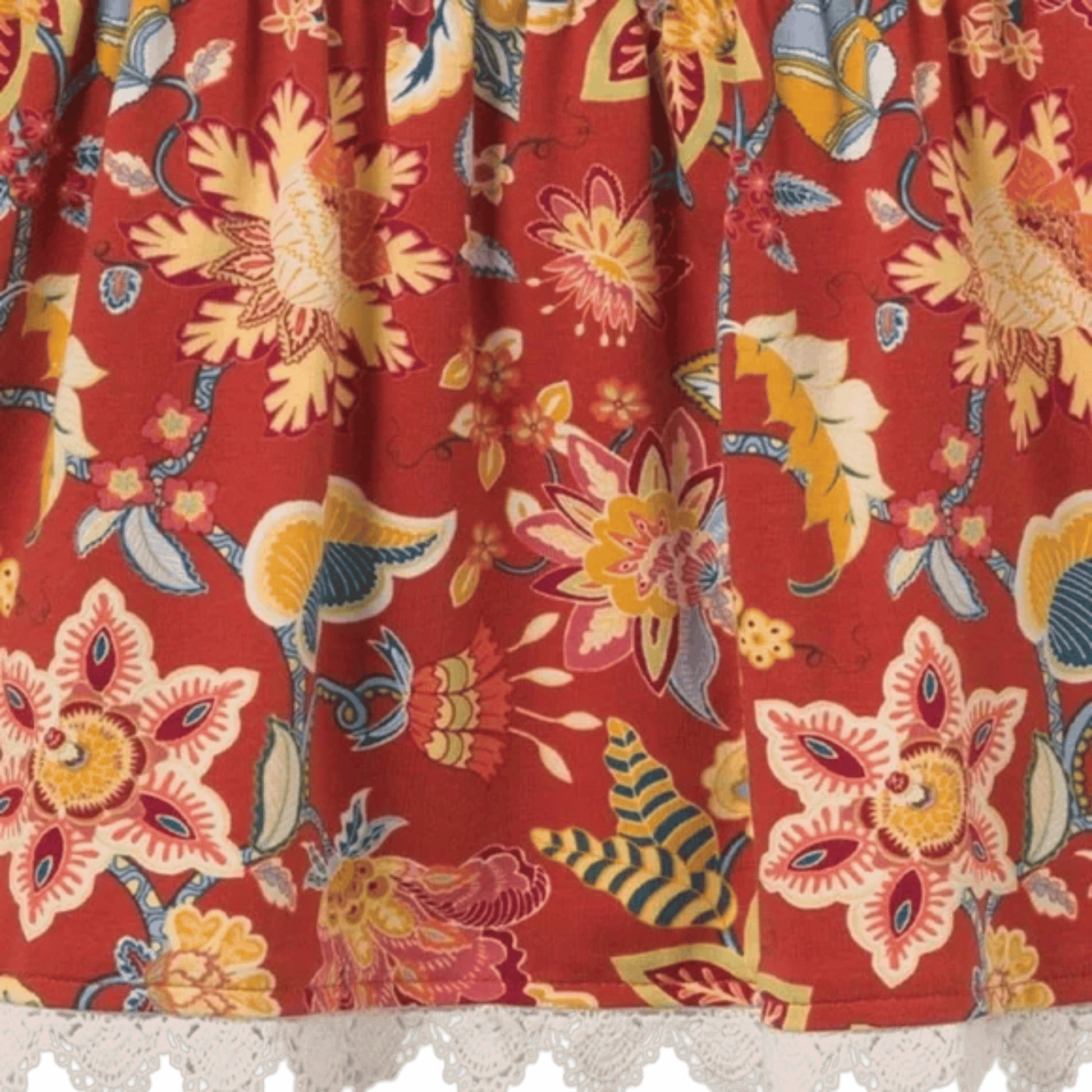 Close-up of colorful floral fabric with a red background