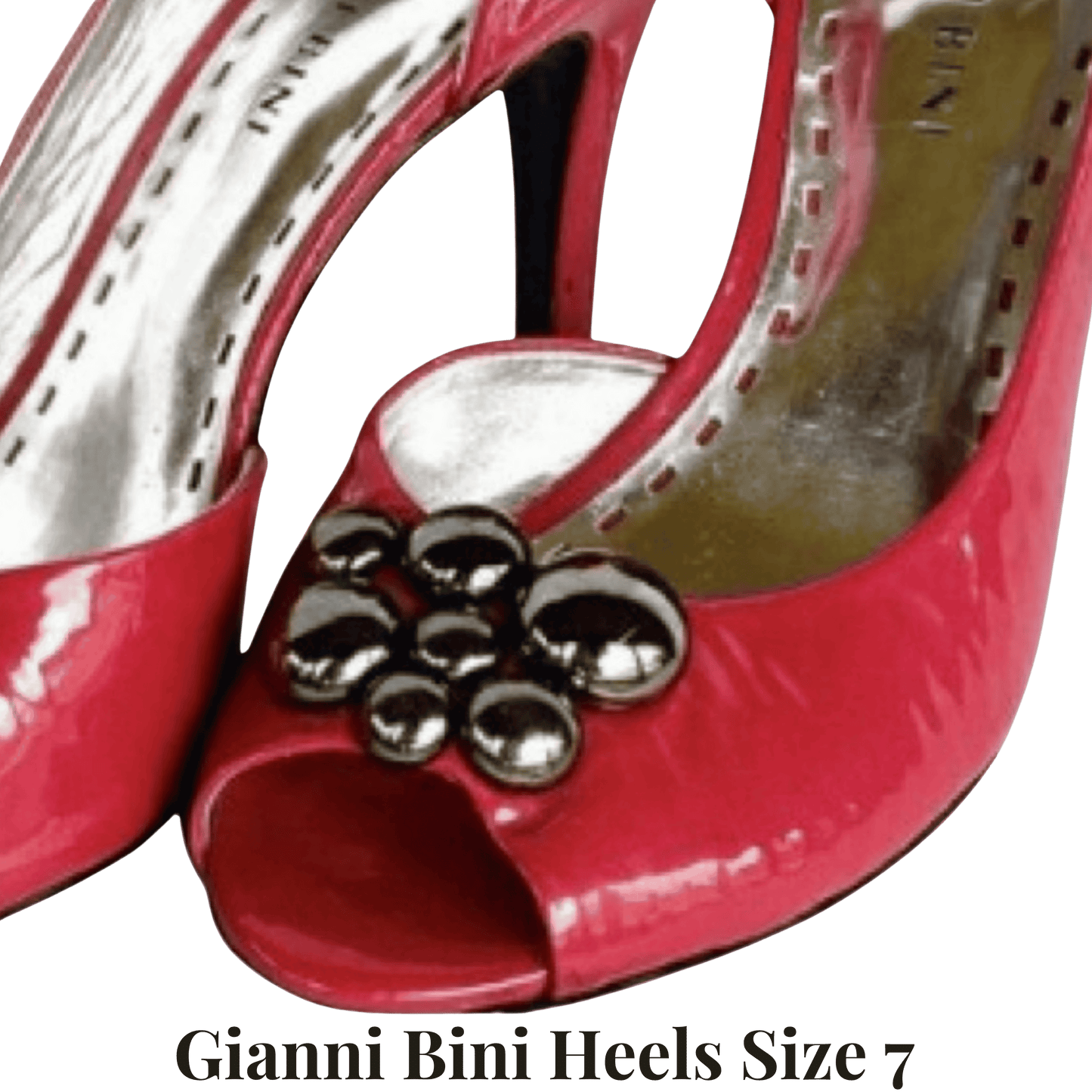 Red high-heeled shoes with a decorative flower on a transparent background, labeled 'Gianni Bini Heels Size 7'.