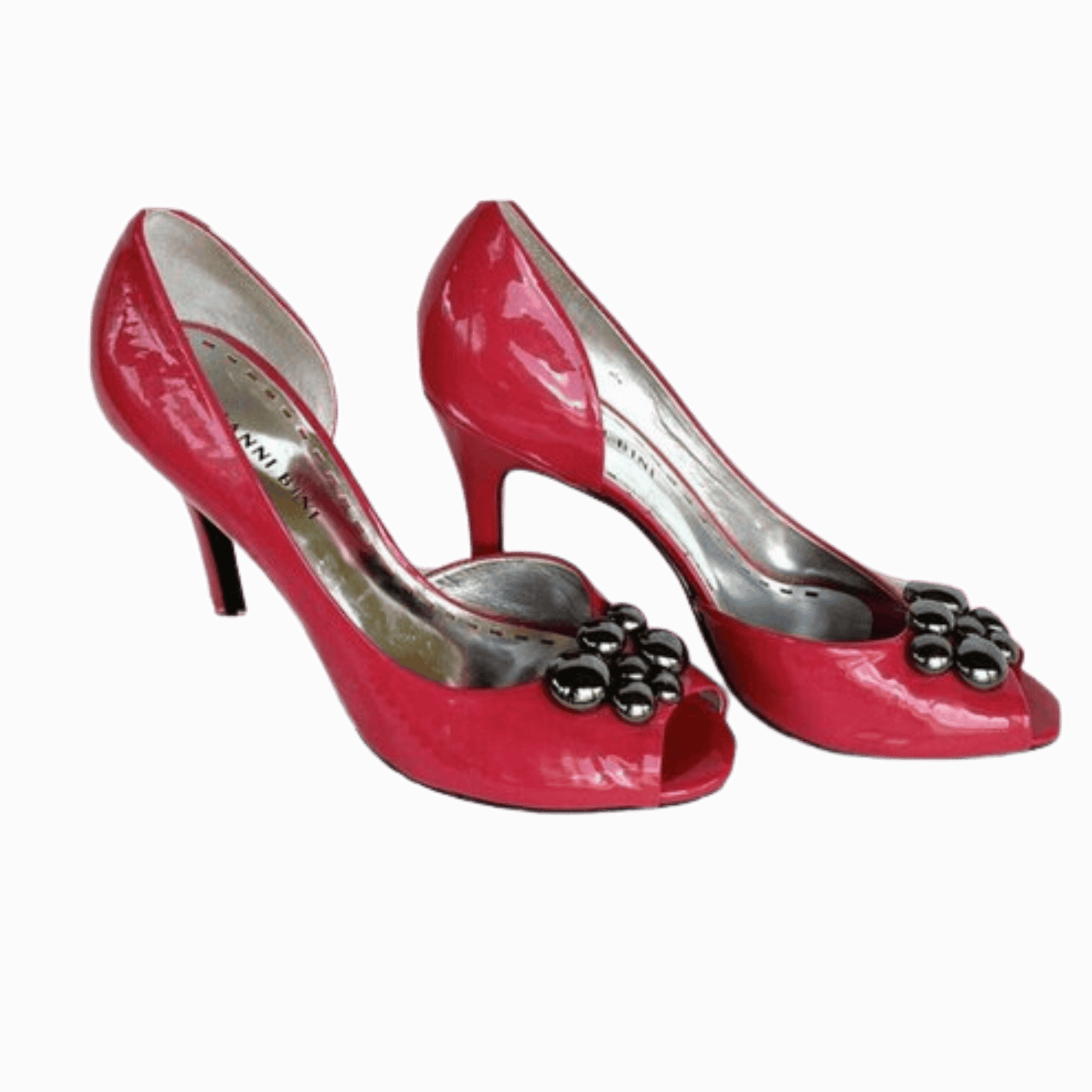 Red high-heeled shoes with decorative elements on a transparent background