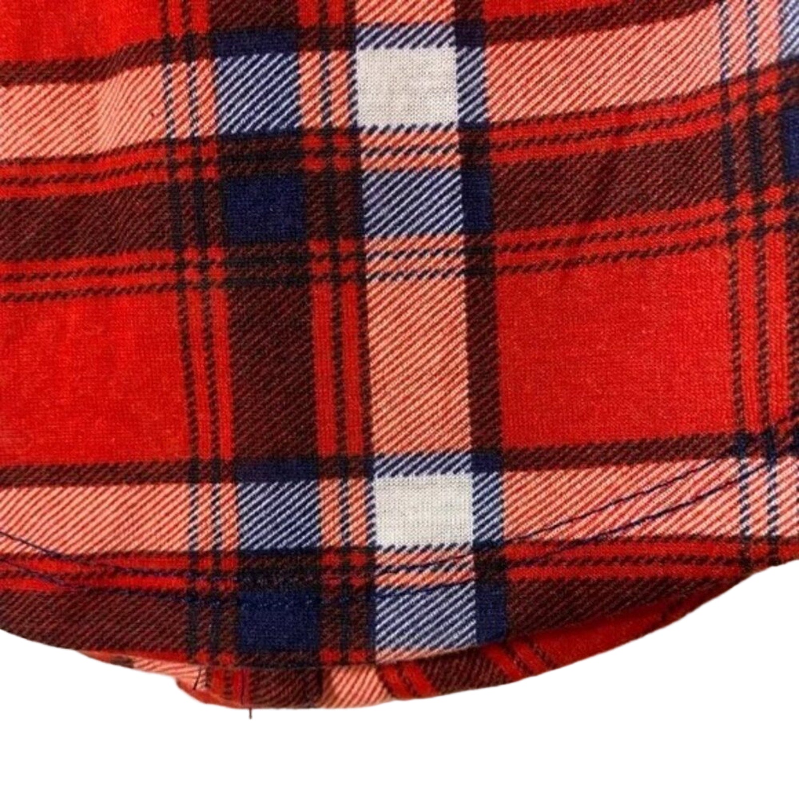 Close-up of a red plaid fabric with a white background