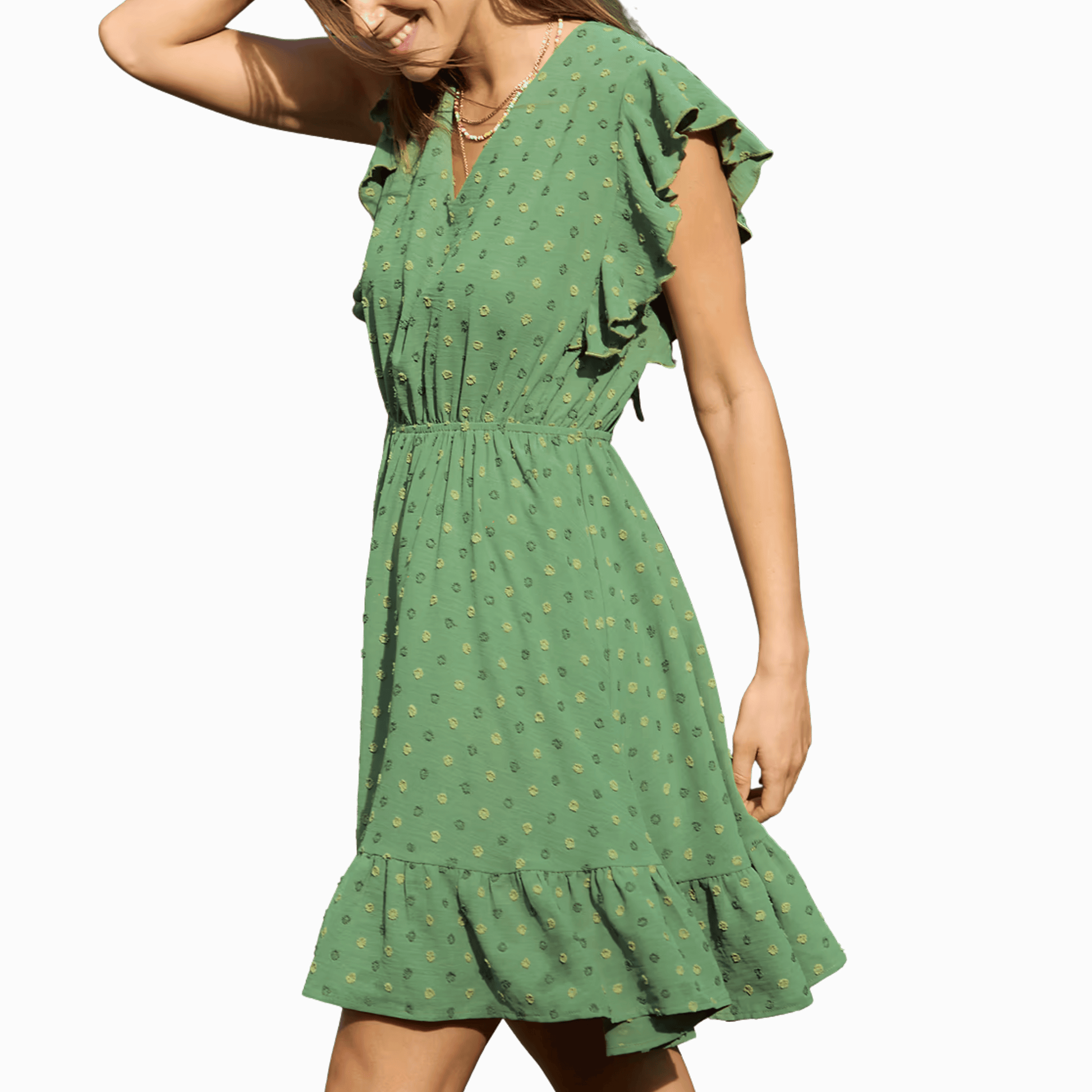 Green dress with ruffled sleeves and hem on a dark background