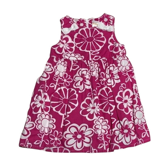Pink dress with white floral pattern on a white background