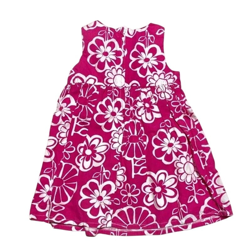 Pink dress with white floral pattern on a white background
