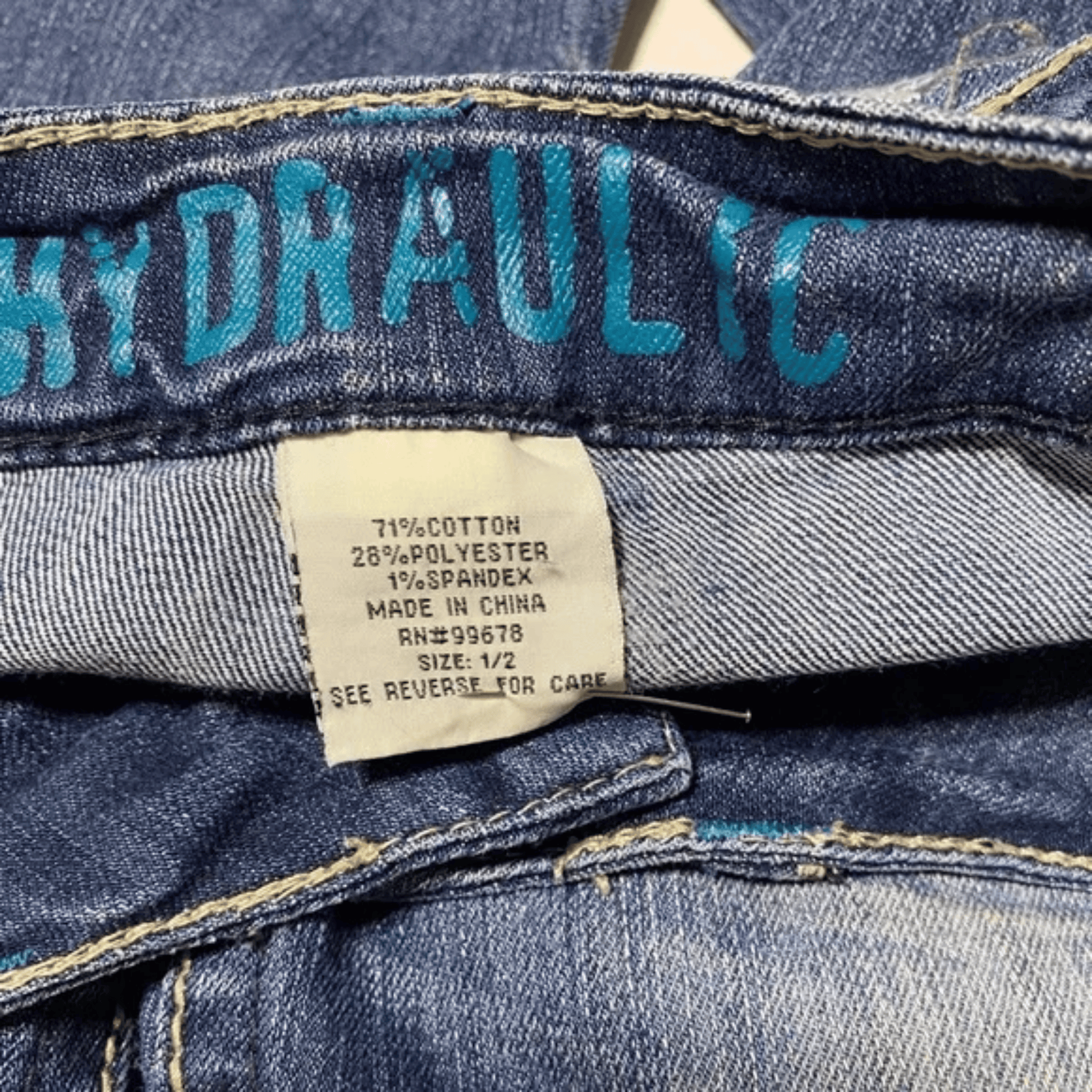 Close-up of a label on a pair of blue jeans with 'Hydraulic' branding.