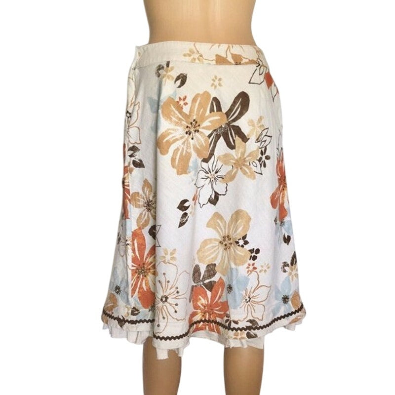 Floral skirt on a mannequin with a white background
