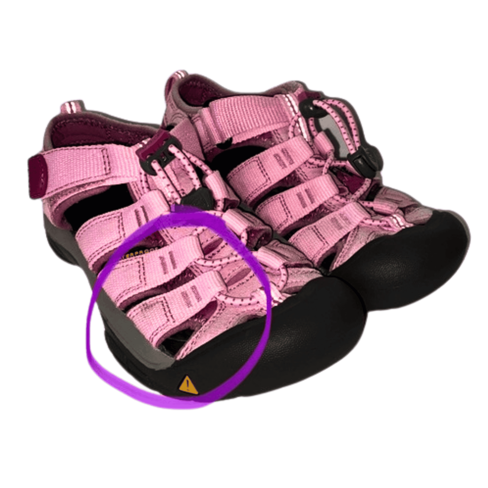 Pink children's sandals with black soles on a white background