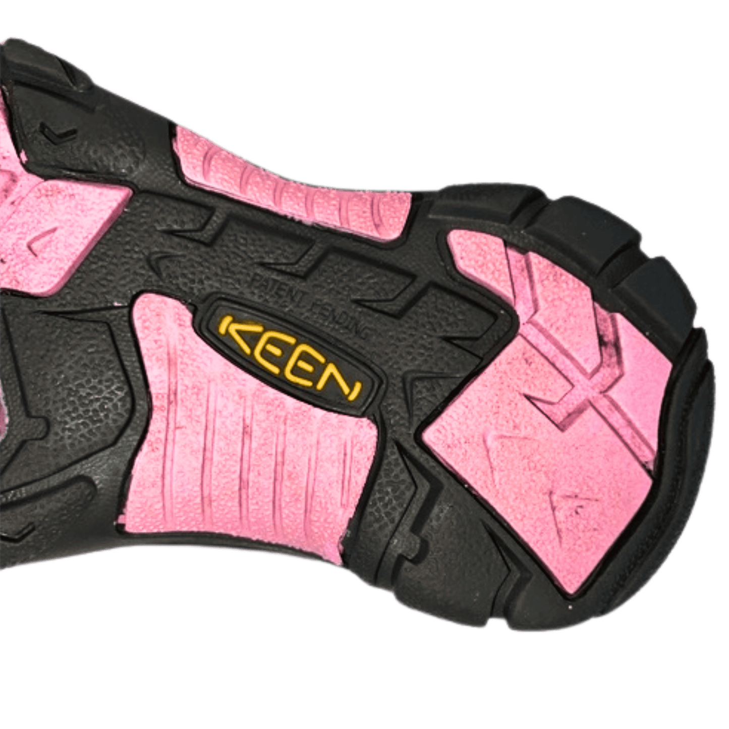 Close-up of a pink and black shoe sole with 'Keen' branding on a white background