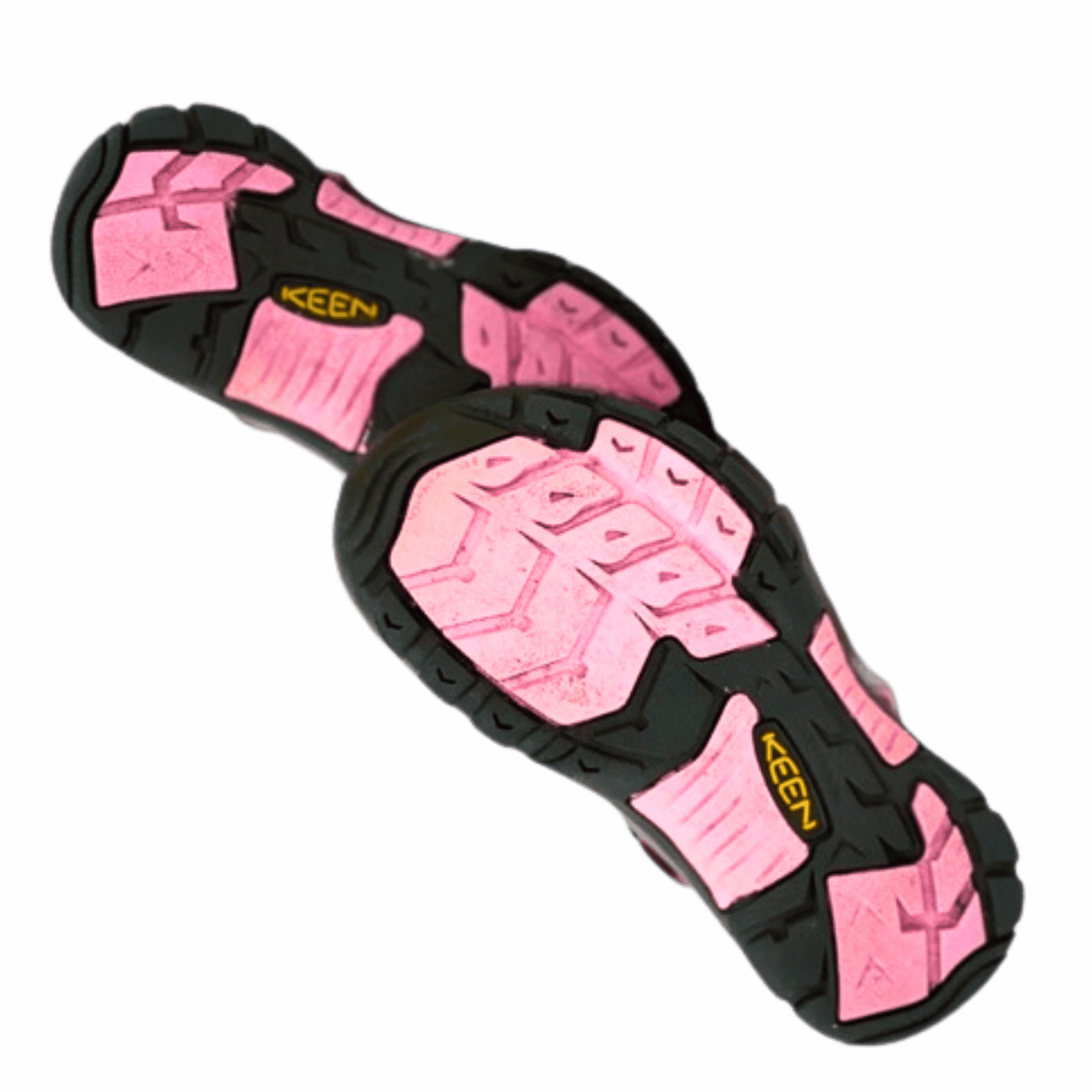 Pink and black KEEN sandals on a gray background
