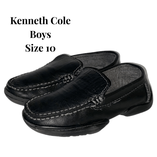 Black loafers with 'Kenneth Cole Boys Size 10' text on a transparent background