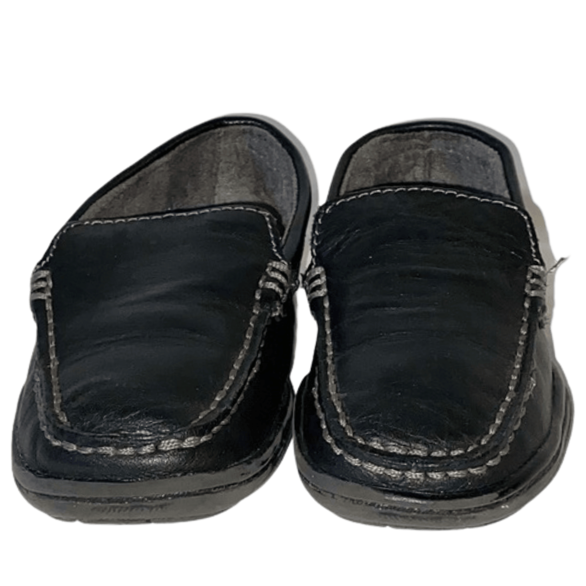 Pair of black slip-on shoes on a transparent background