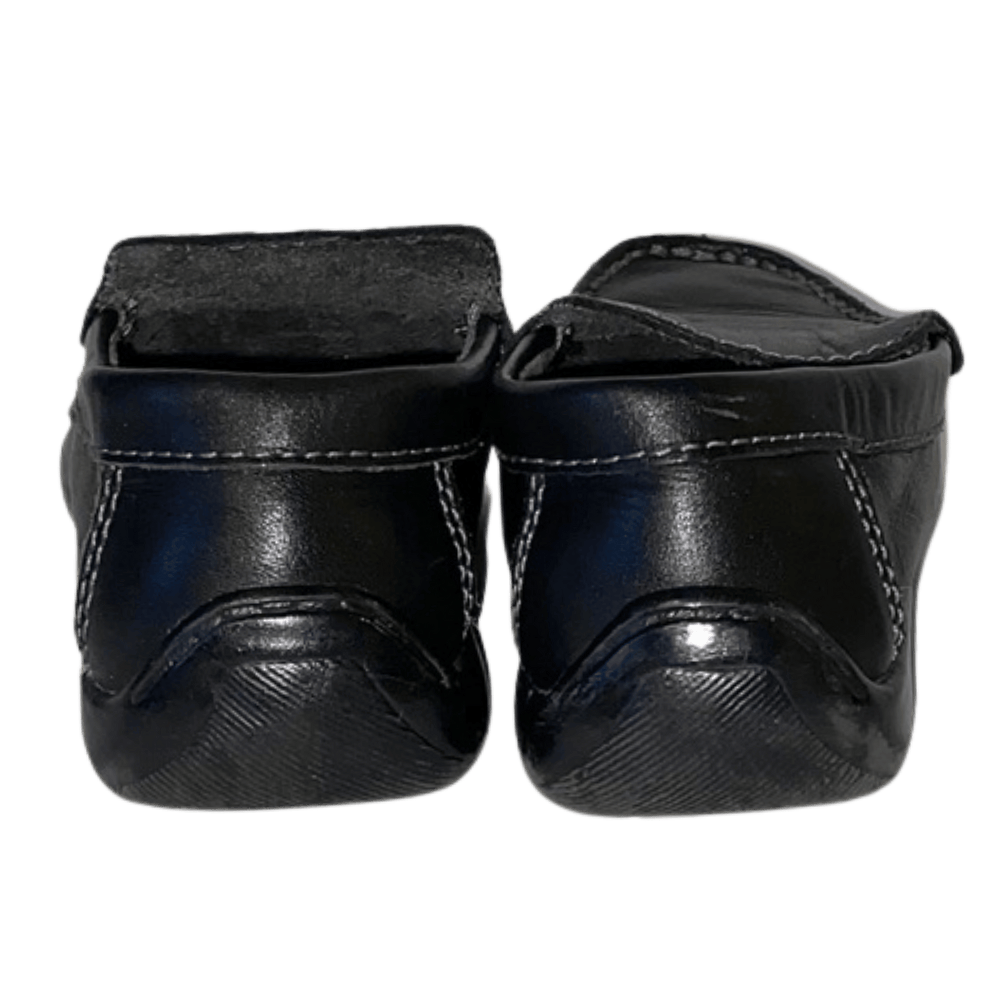 Pair of black leather shoes on a transparent background
