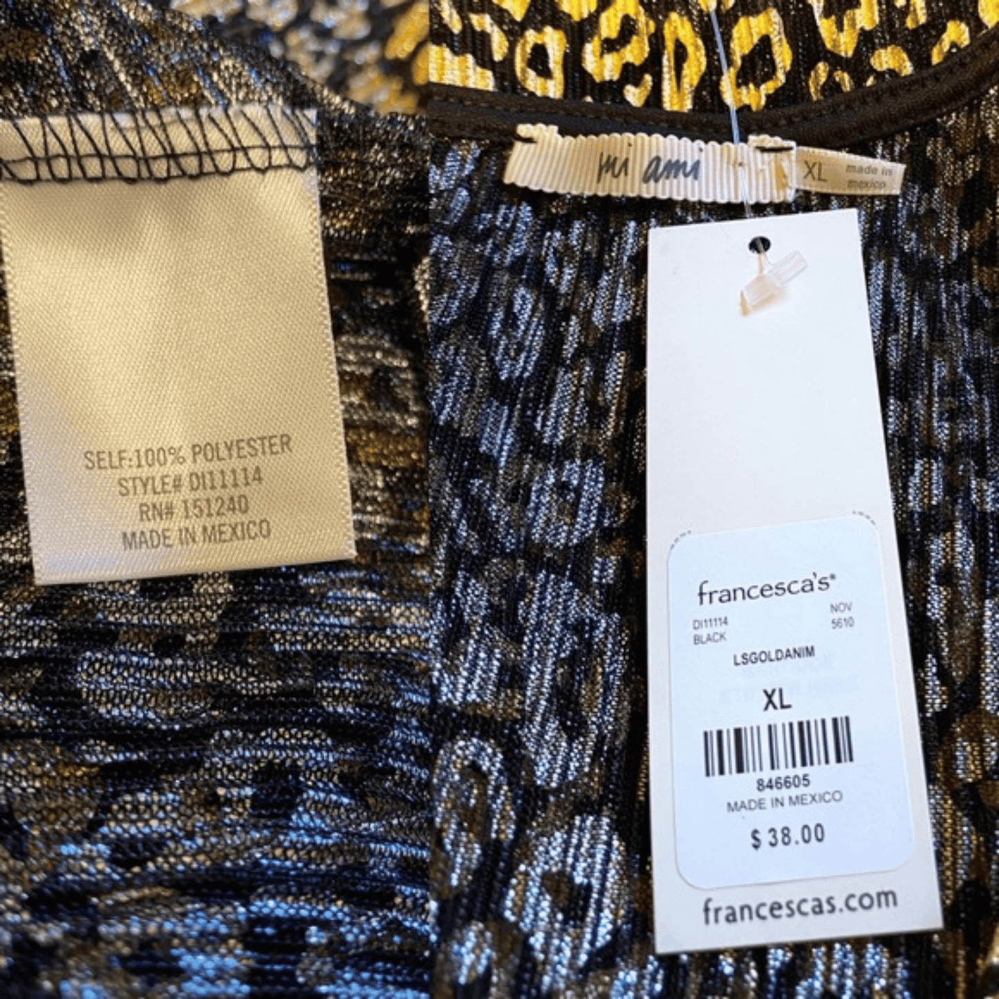 Close-up of a patterned fabric with a tag displaying 'francesca's' branding and product details.