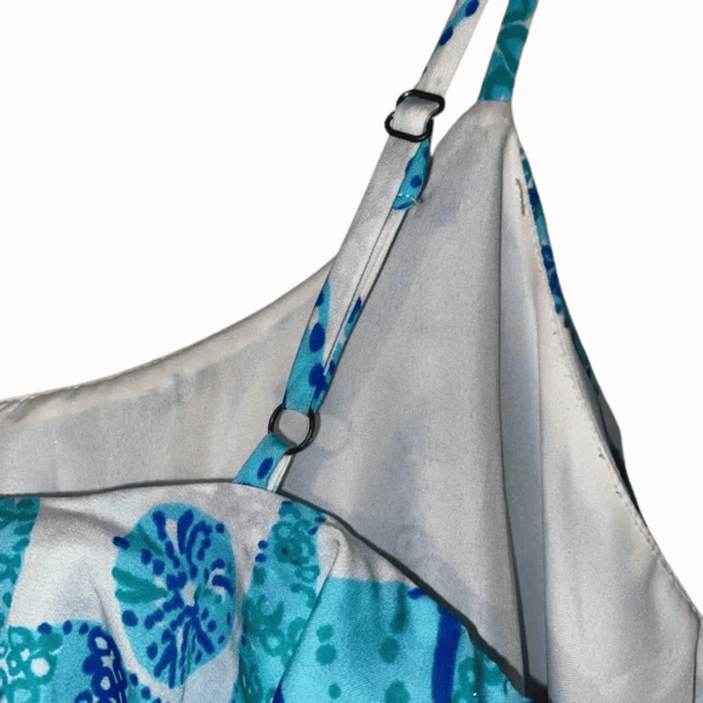 White apron with blue floral patterns on a gray background