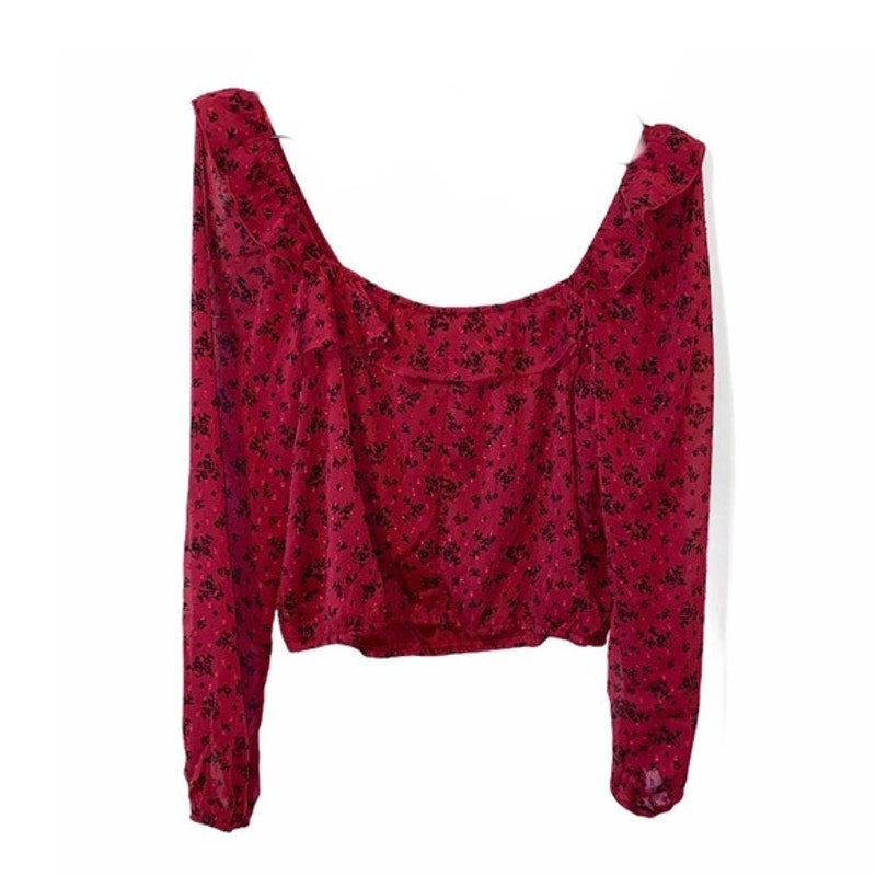 Red floral-patterned top on a white background