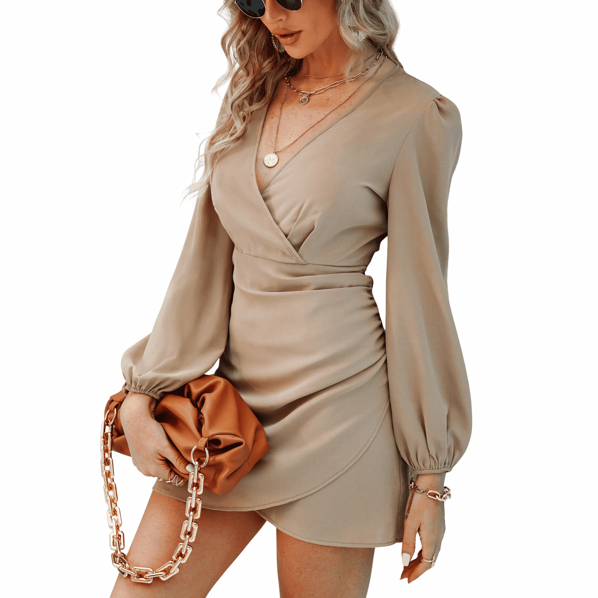 Woman wearing a beige dress with long sleeves against a blue background