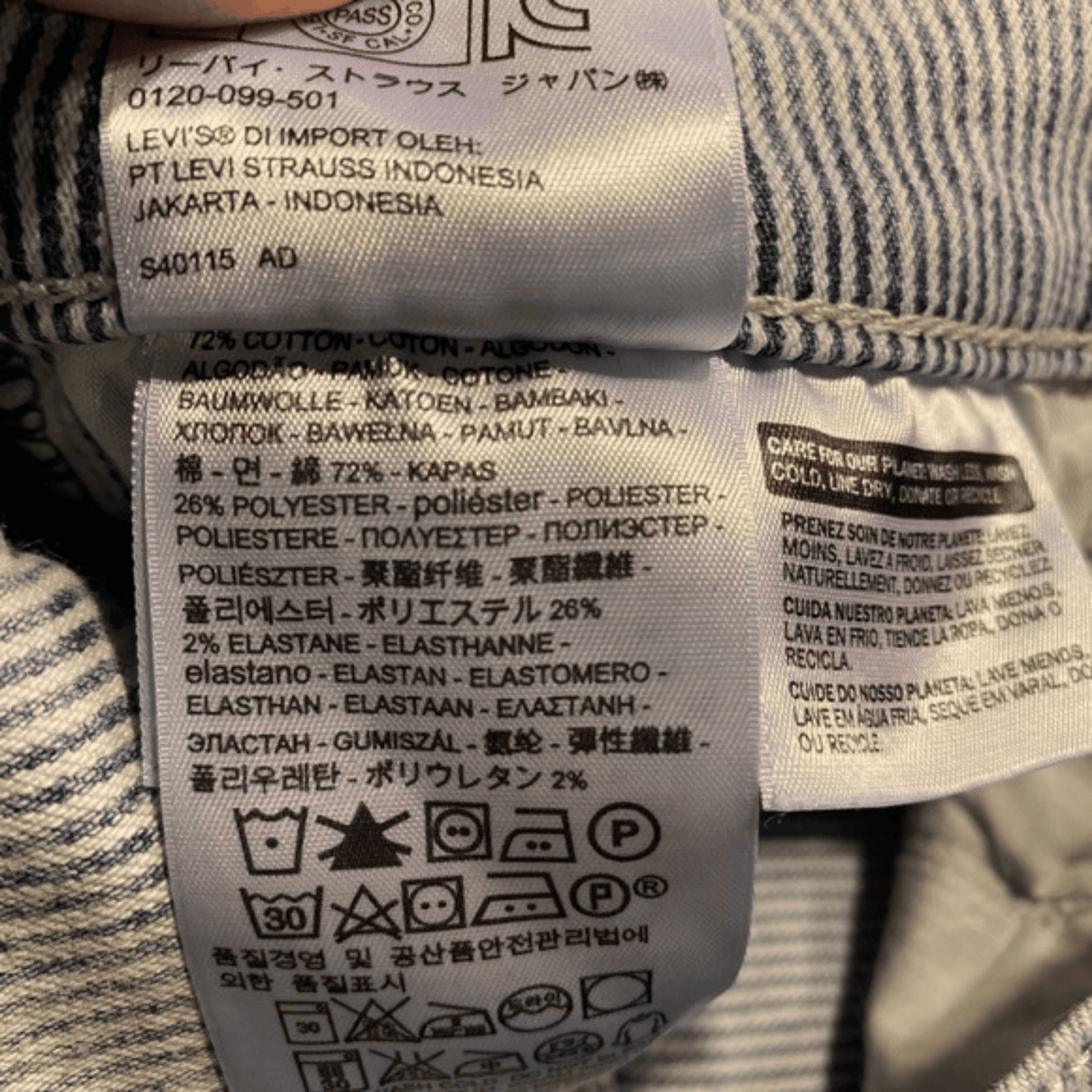 Close-up of Levi's label on denim fabric with text and symbols.
