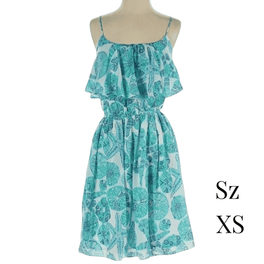 Teal and white floral dress on a mannequin with 'Sz XS' text.