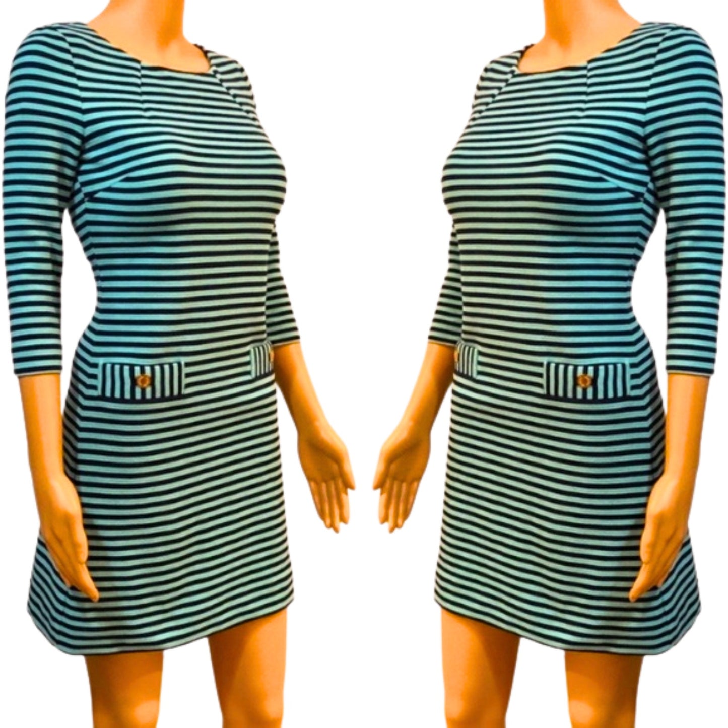 Green and black striped dress on a mannequin against a white background