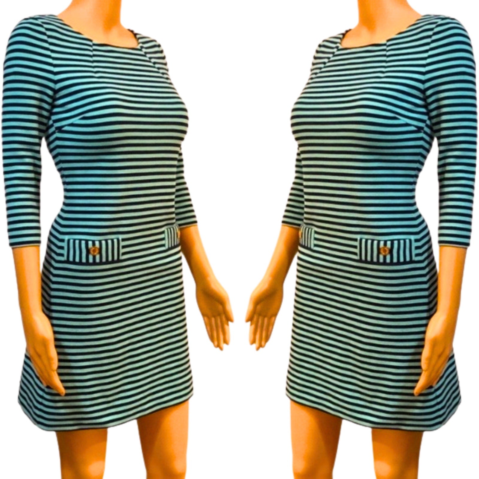 Green and black striped dress on a mannequin against a white background