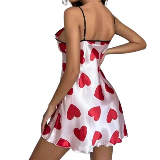 White satin nightgown with red heart patterns on a white background