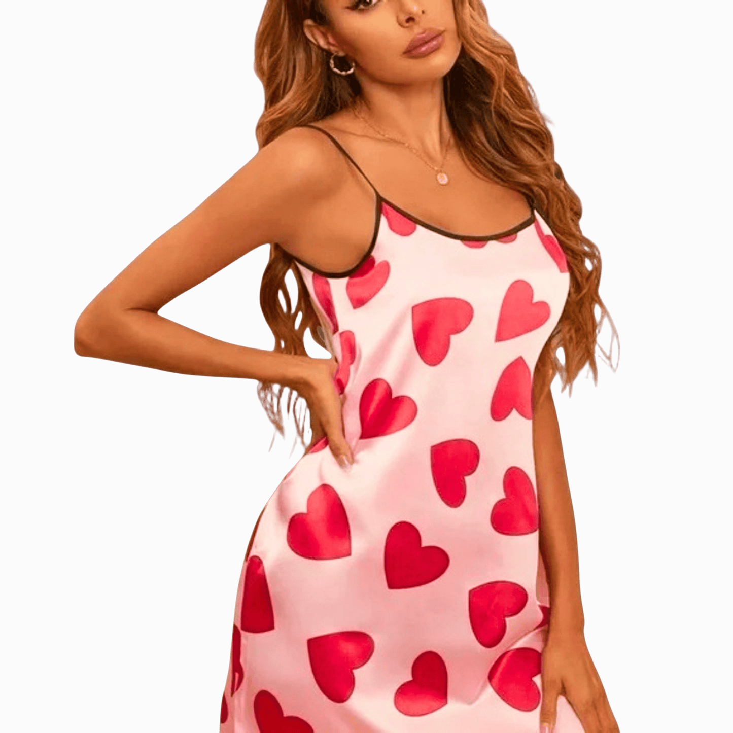 Woman wearing a pink nightgown with red heart patterns on a brown background