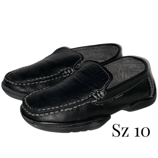 Pair of black loafers with 'Sz 10' label on a transparent background