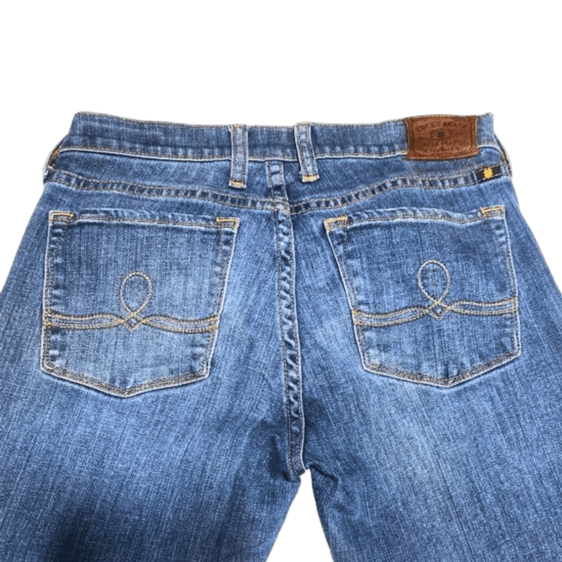 Back view of blue jeans with a brand label on a transparent background