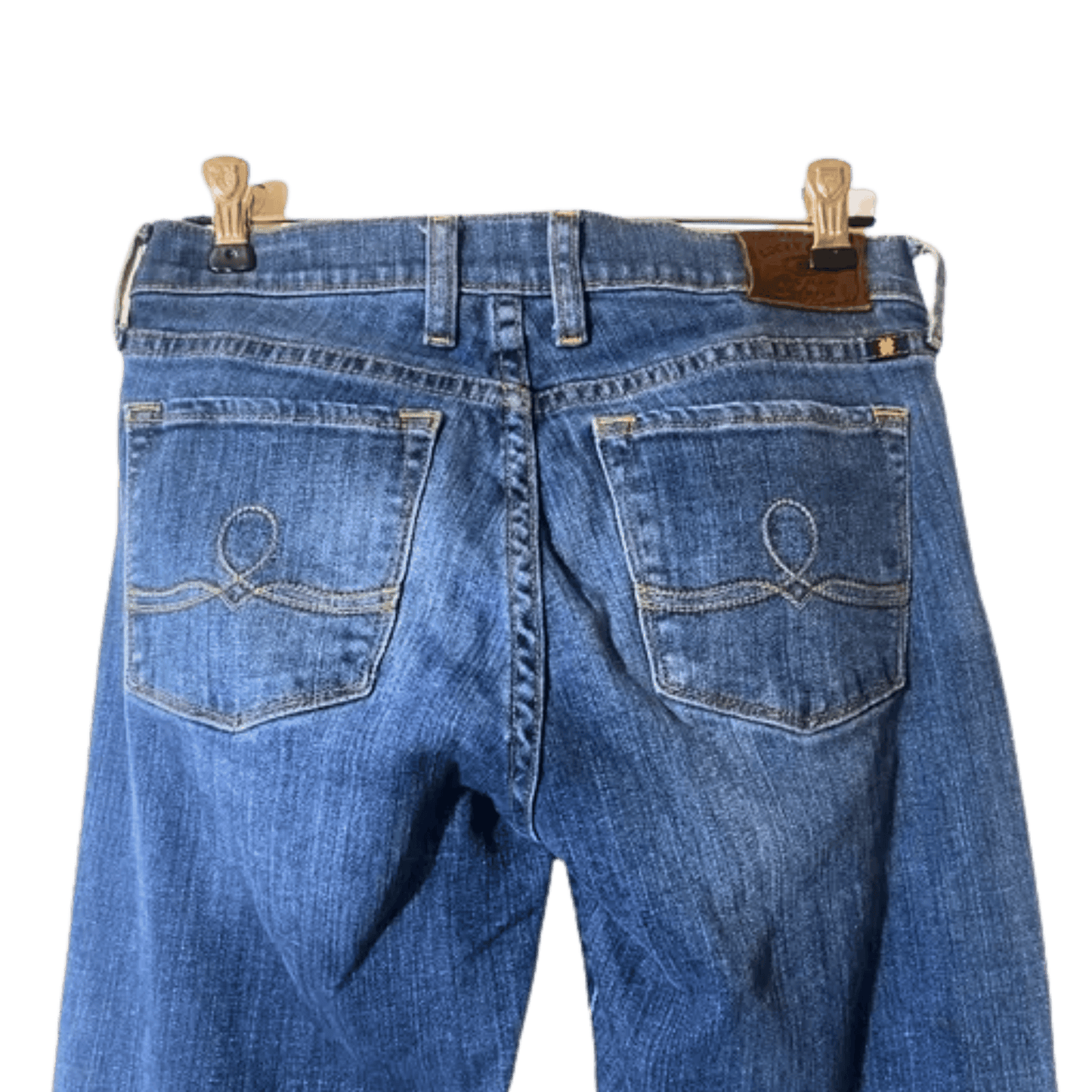 Blue jeans on a hanger with a transparent background