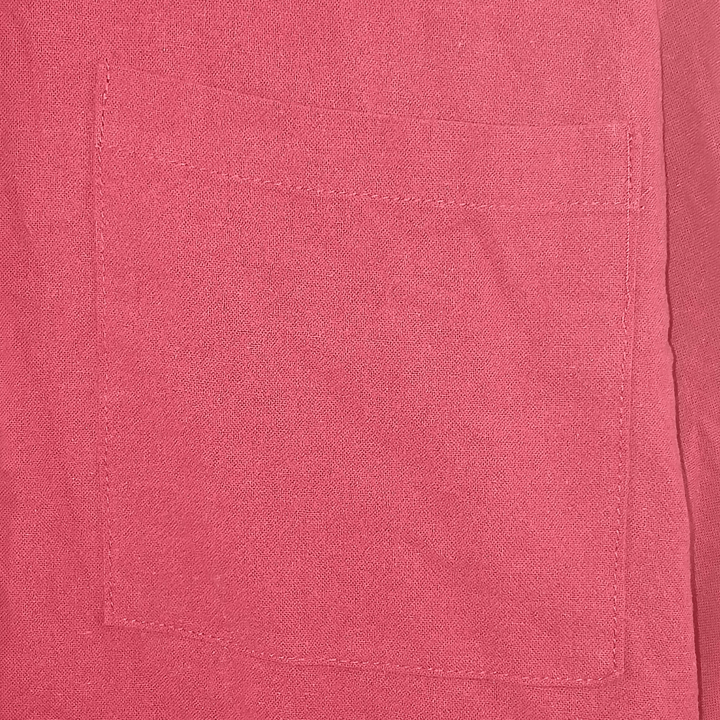 Close-up of a pink fabric pocket with stitching details