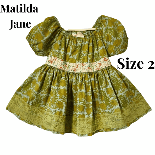 Children's dress with floral pattern on a green background, featuring 'Matilda Jane' brand.