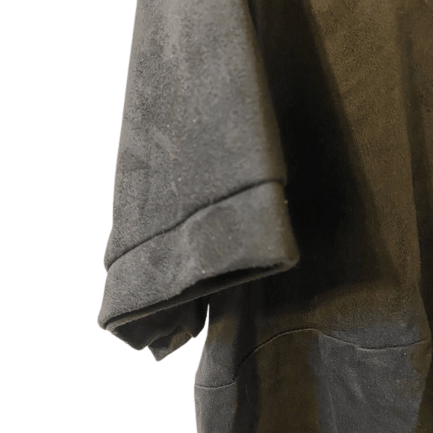 Close-up of a textured gray garment with a green background