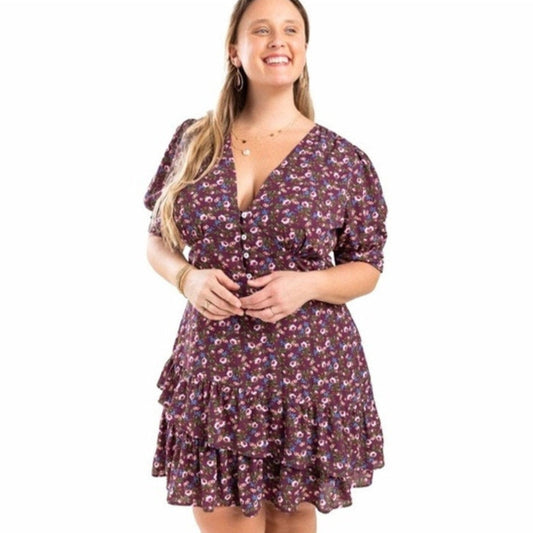Woman wearing a floral dress on a white background