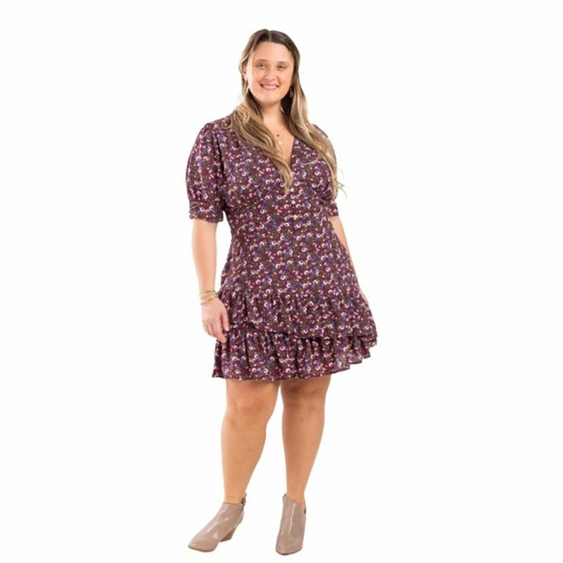 Woman wearing a floral dress on a white background
