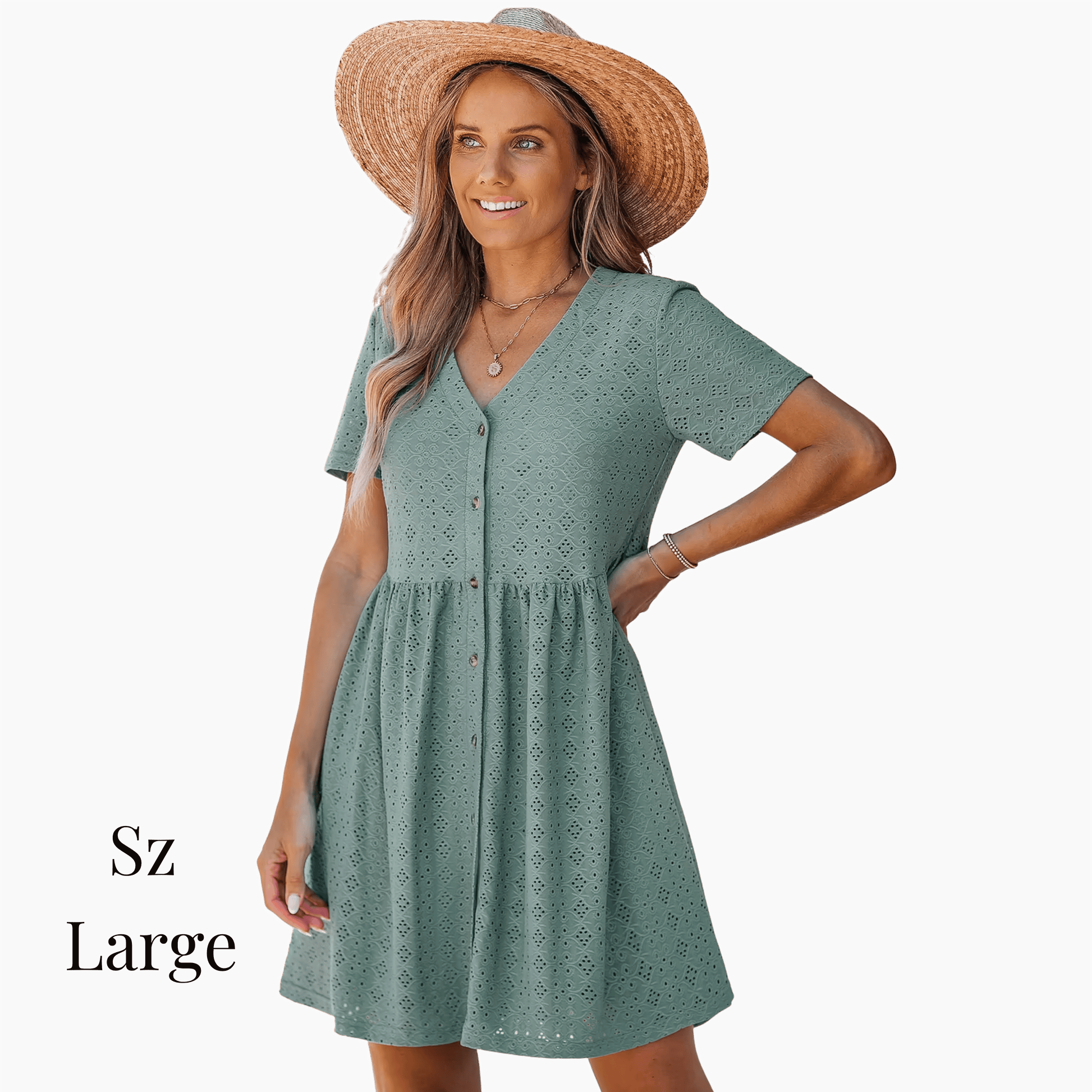Woman wearing a green dress and straw hat on a gray background