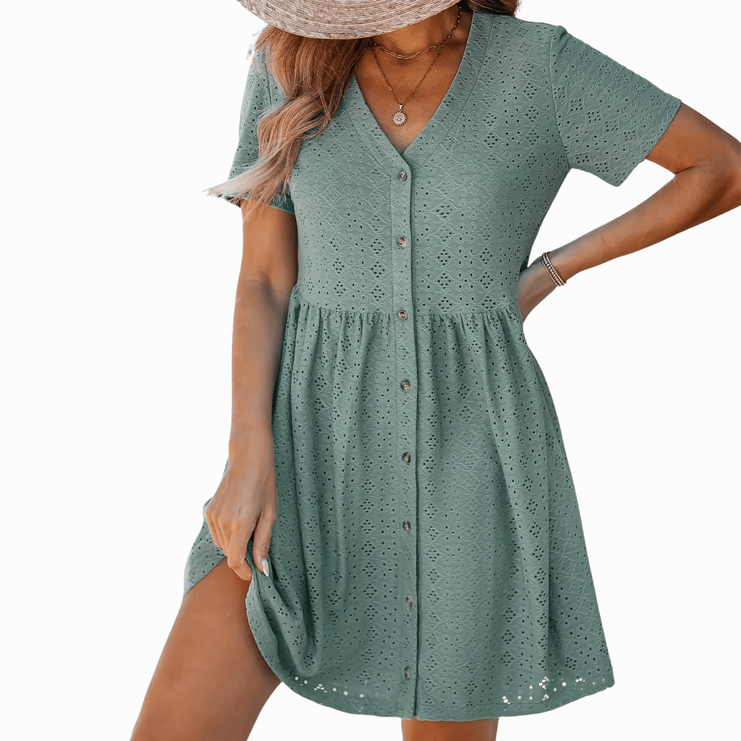 Woman wearing a green dress with a purple background