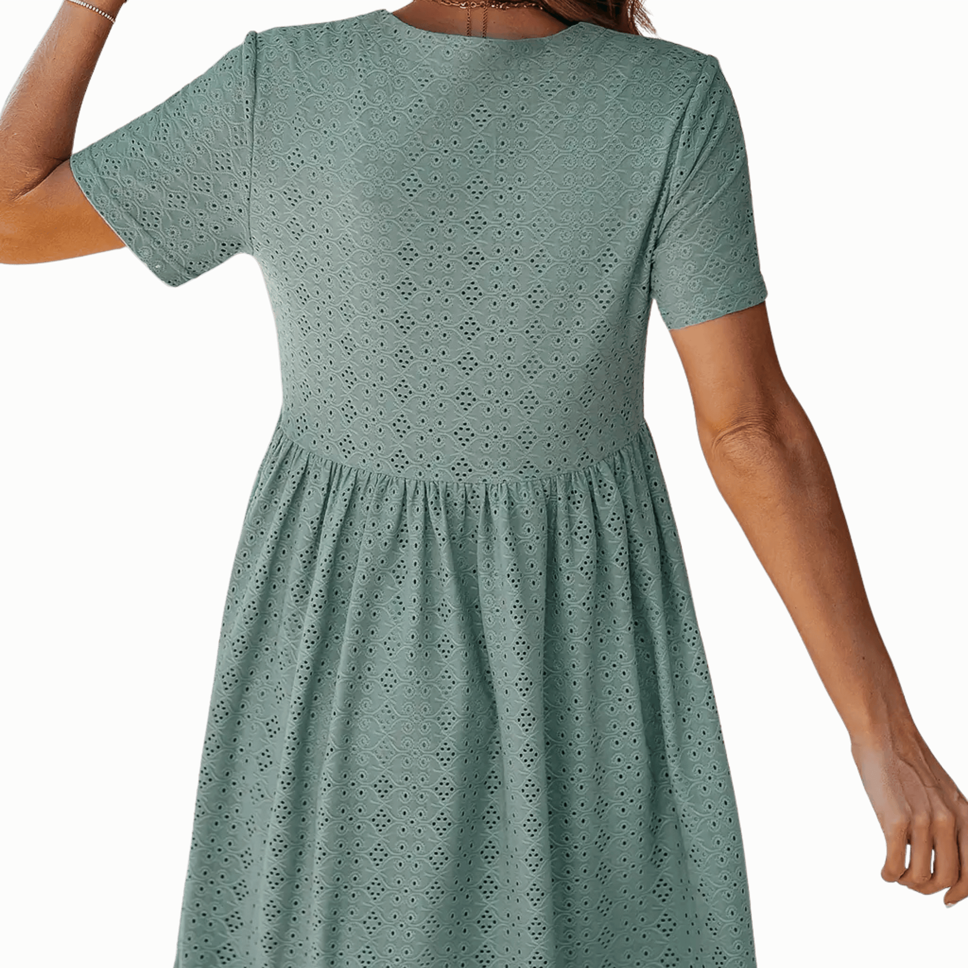 Green dress with short sleeves and a patterned design on a green background